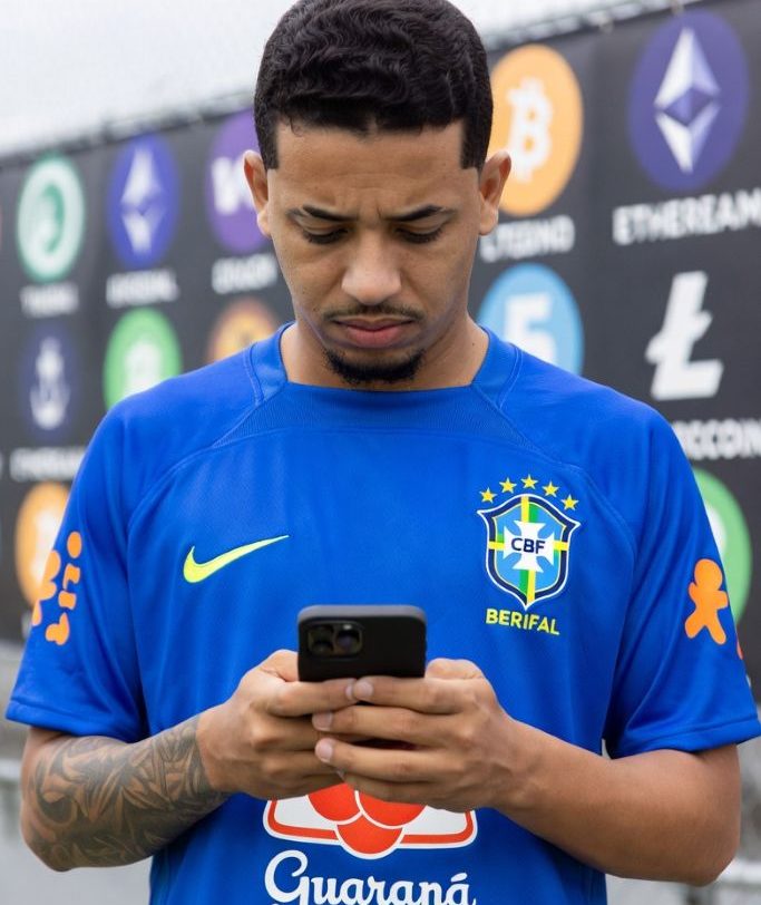 Brazilian football fan checking betting odds