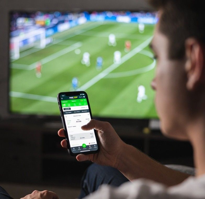 watching and betting on football match